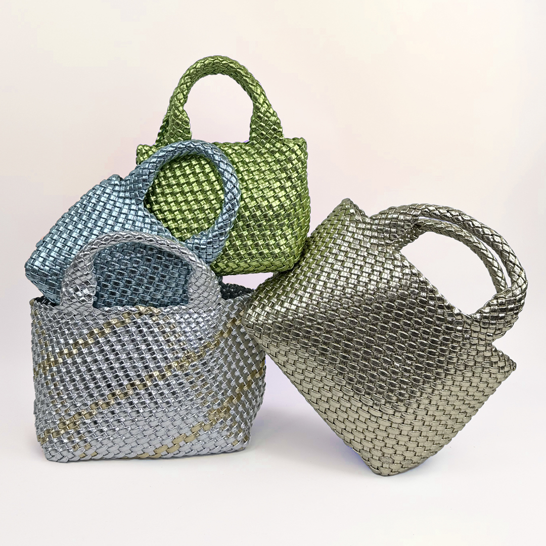 stack of metallic woven totes